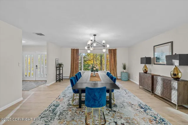 a view of a tree in a backyard of a house