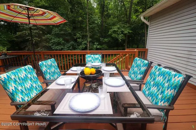 a view of a yard with wooden fence