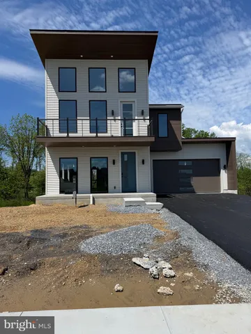 a front view of a house with yard