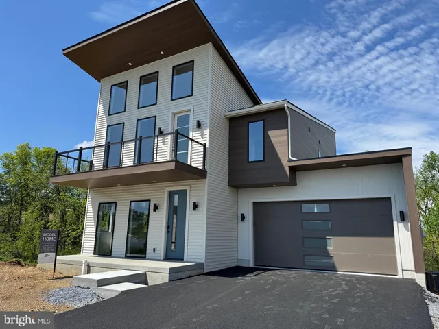 a front view of a house with a garage