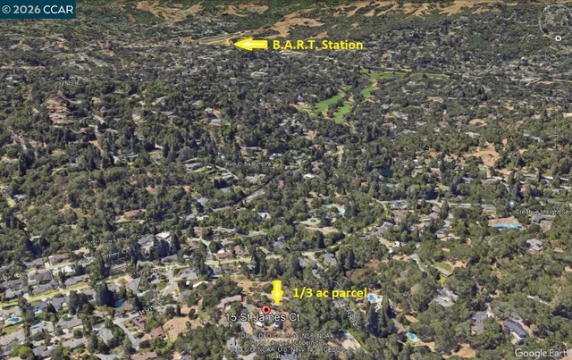 a green field with trees in the background