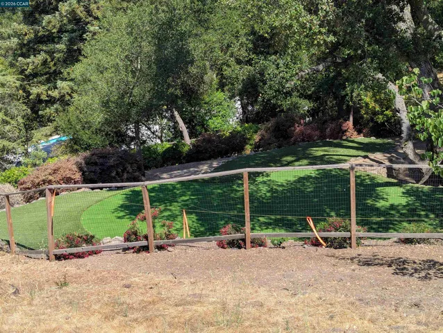 a view of a backyard of the house