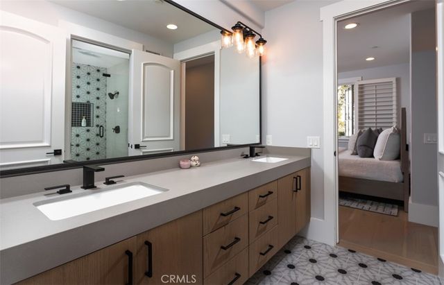 a bathroom with a double vanity sink mirror and double