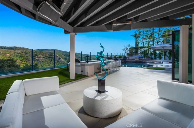 a patio with a table and chairs