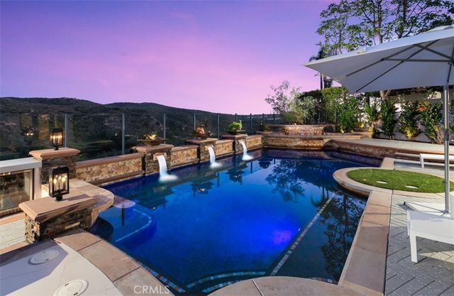 a view of a patio with chairs and a table