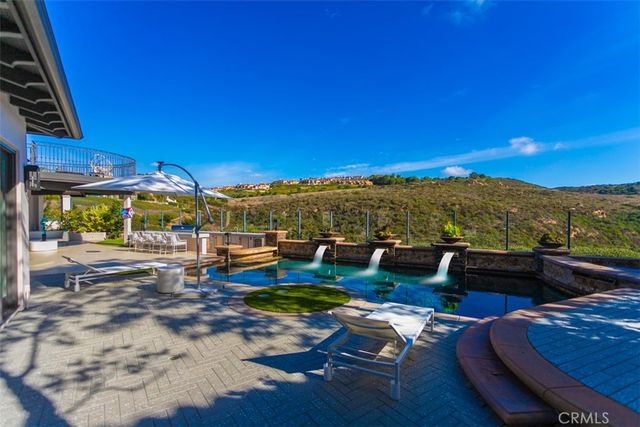 a view of swimming pool with outdoor seating
