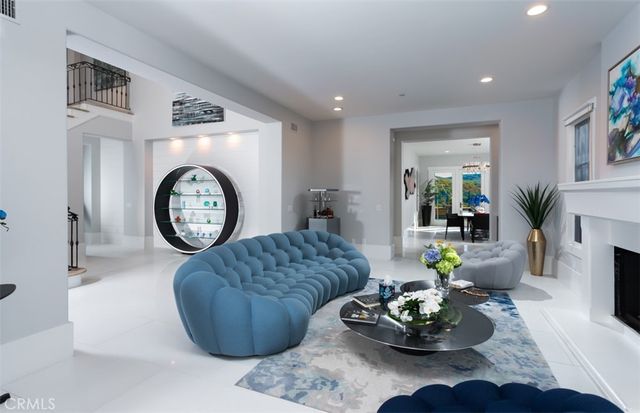 a living room with furniture and a clock