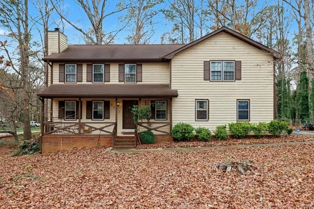a front view of a house with garden