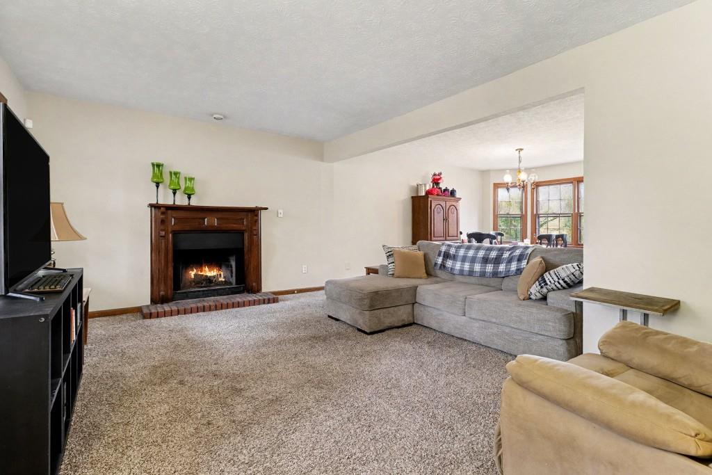 9133 Snipe Lane Jonesboro, GA 30236 - Photo 12 of 36 a living room with furniture and a fireplace