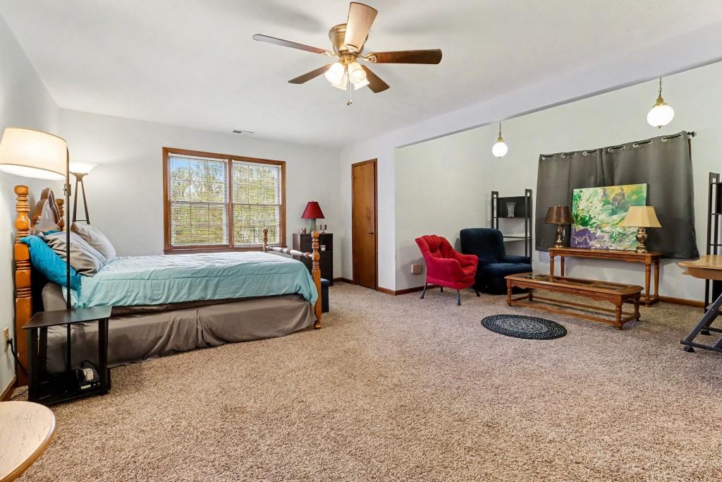 9133 Snipe Lane Jonesboro, GA 30236 - Photo 20 of 36 a bedroom with furniture and a flat screen tv