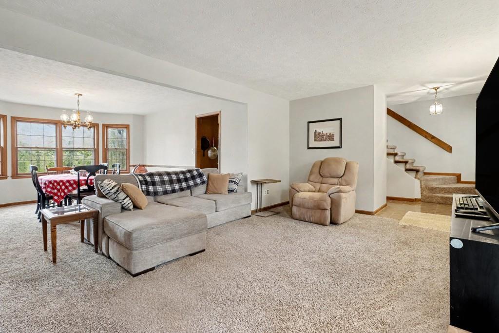 9133 Snipe Lane Jonesboro, GA 30236 - Photo 2 of 36 a living room with furniture and a flat screen tv
