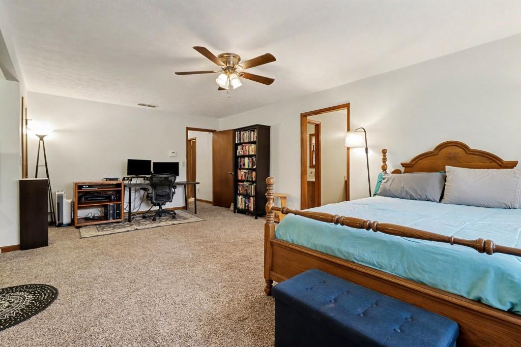 9133 Snipe Lane Jonesboro, GA 30236 - Photo 21 of 36 a bedroom with a bed and a television