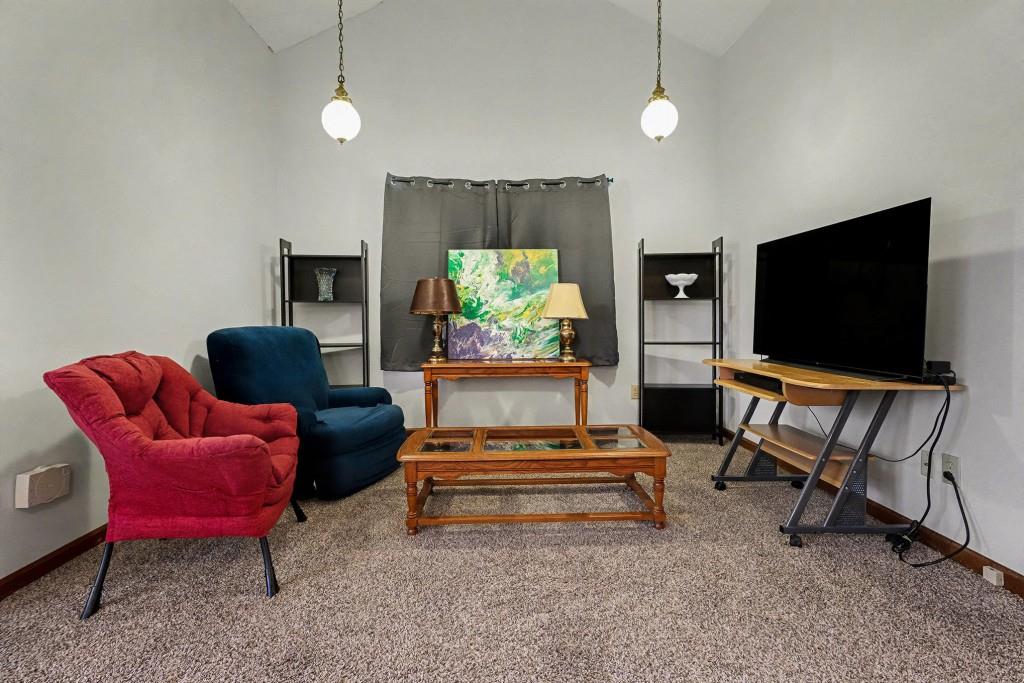 9133 Snipe Lane Jonesboro, GA 30236 - Photo 22 of 36 a living room with furniture and a flat screen tv