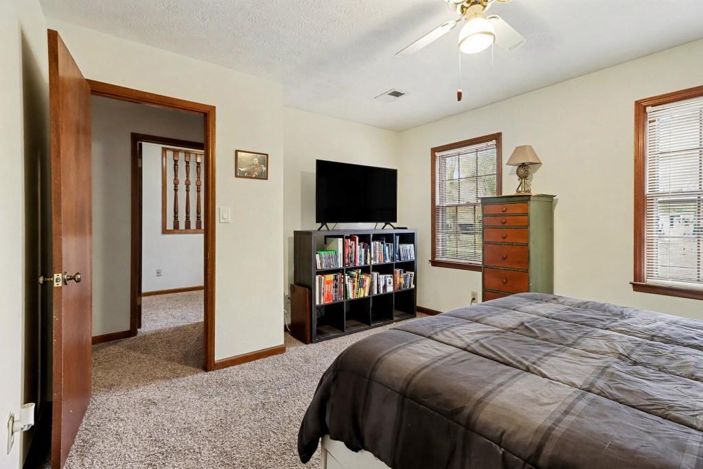 9133 Snipe Lane Jonesboro, GA 30236 - Photo 26 of 36 a bedroom with a bed and a television