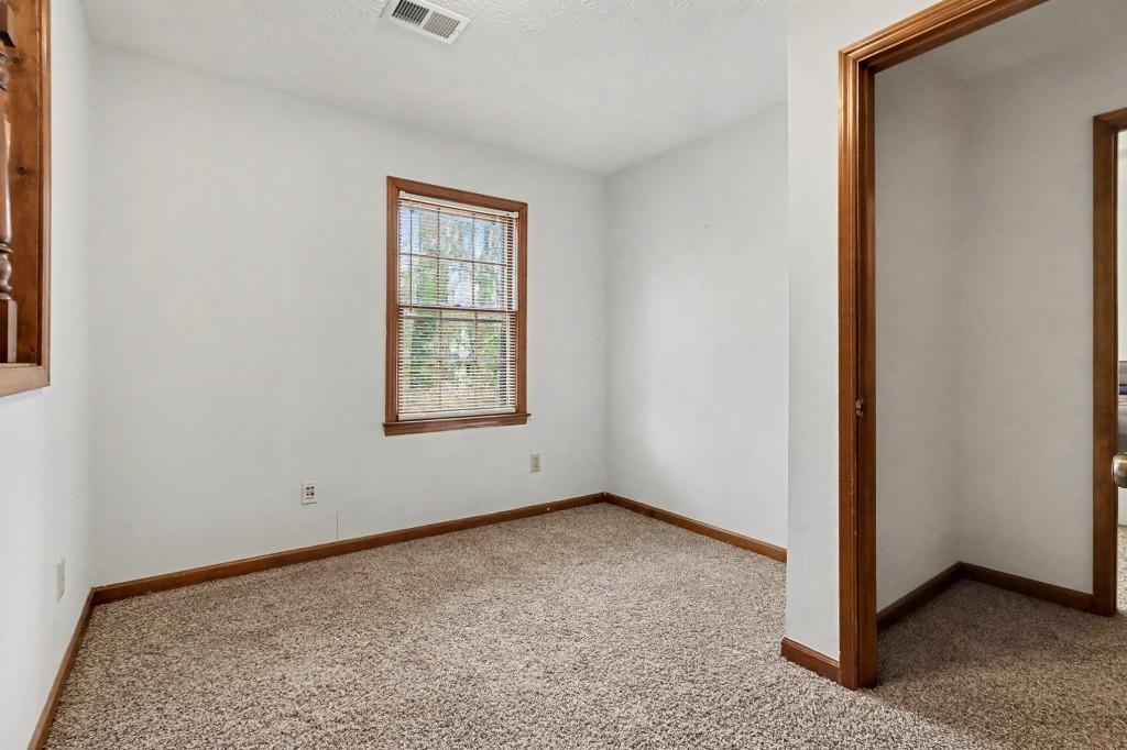 9133 Snipe Lane Jonesboro, GA 30236 - Photo 31 of 36 an empty room with windows