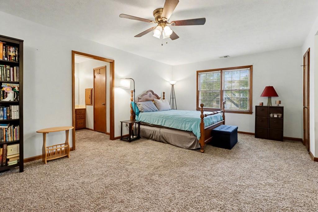 9133 Snipe Lane Jonesboro, GA 30236 - Photo 4 of 36 a bed room with furniture and a window