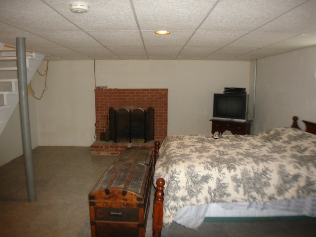 3777 Shutterlee Mill Road Staunton, VA 24401 - Photo 15 of 24 a bedroom with a bed and a television