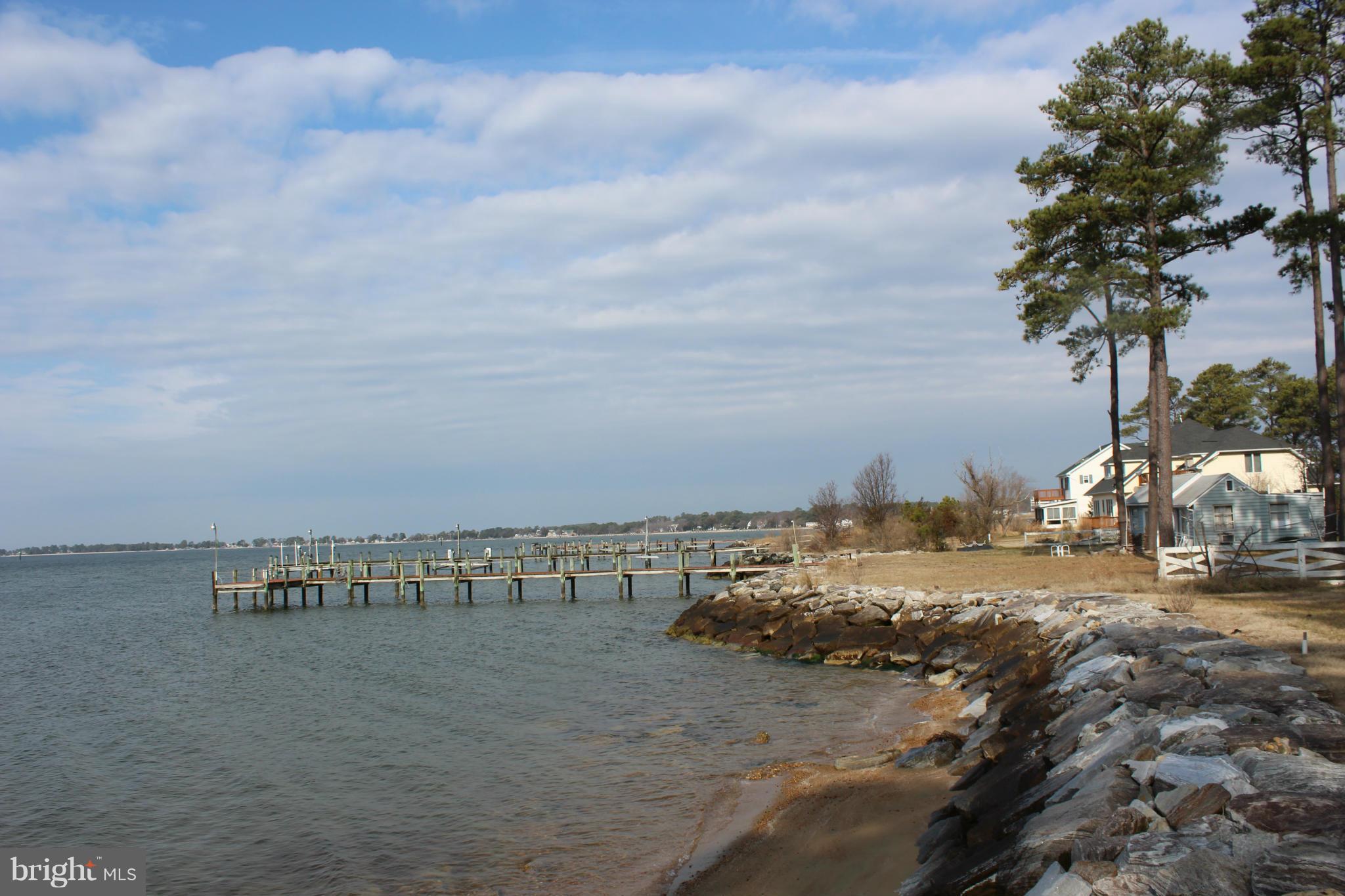 16934 Piney Point Road Piney Point, MD 20674 - Photo 23 of 28 a view of a lake with beach