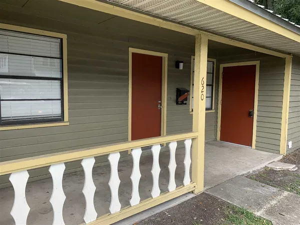 a view of a small house with wooden floor
