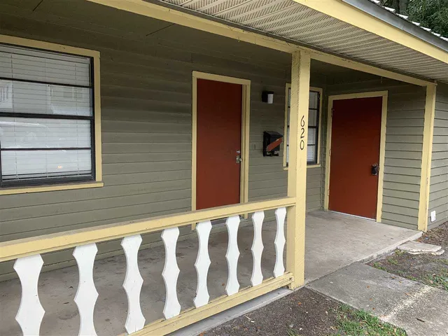 a view of a small house with wooden floor