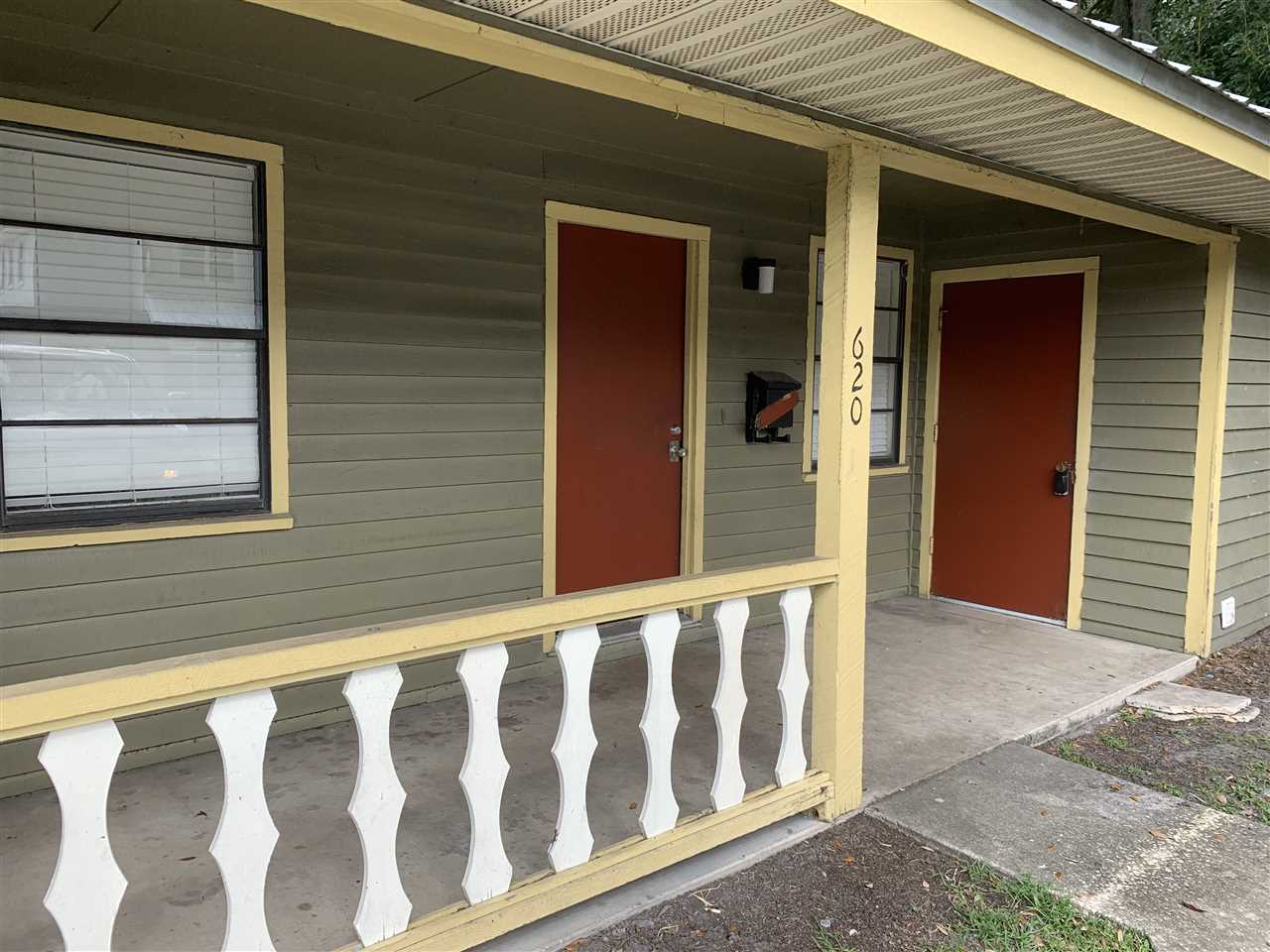 a view of a small house with wooden floor