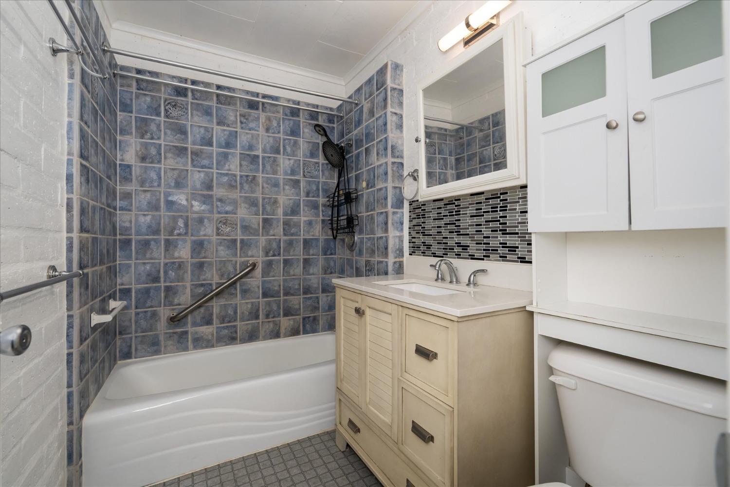 48994 Manzanita Road Oakhurst, CA 93644 - Photo 25 of 43 a bathroom with a sink toilet and shower