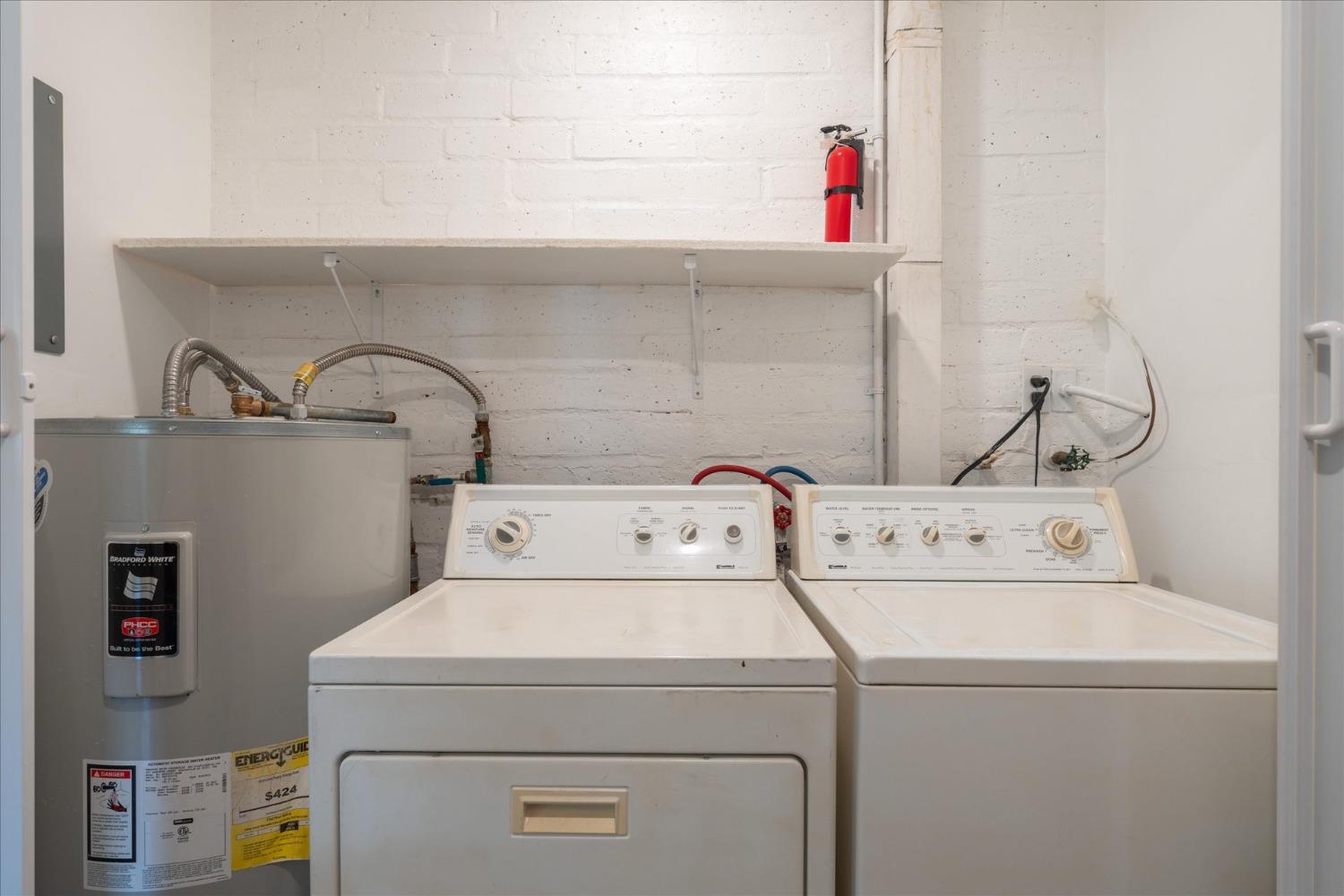 48994 Manzanita Road Oakhurst, CA 93644 - Photo 27 of 43 a utility room with dryer and washer