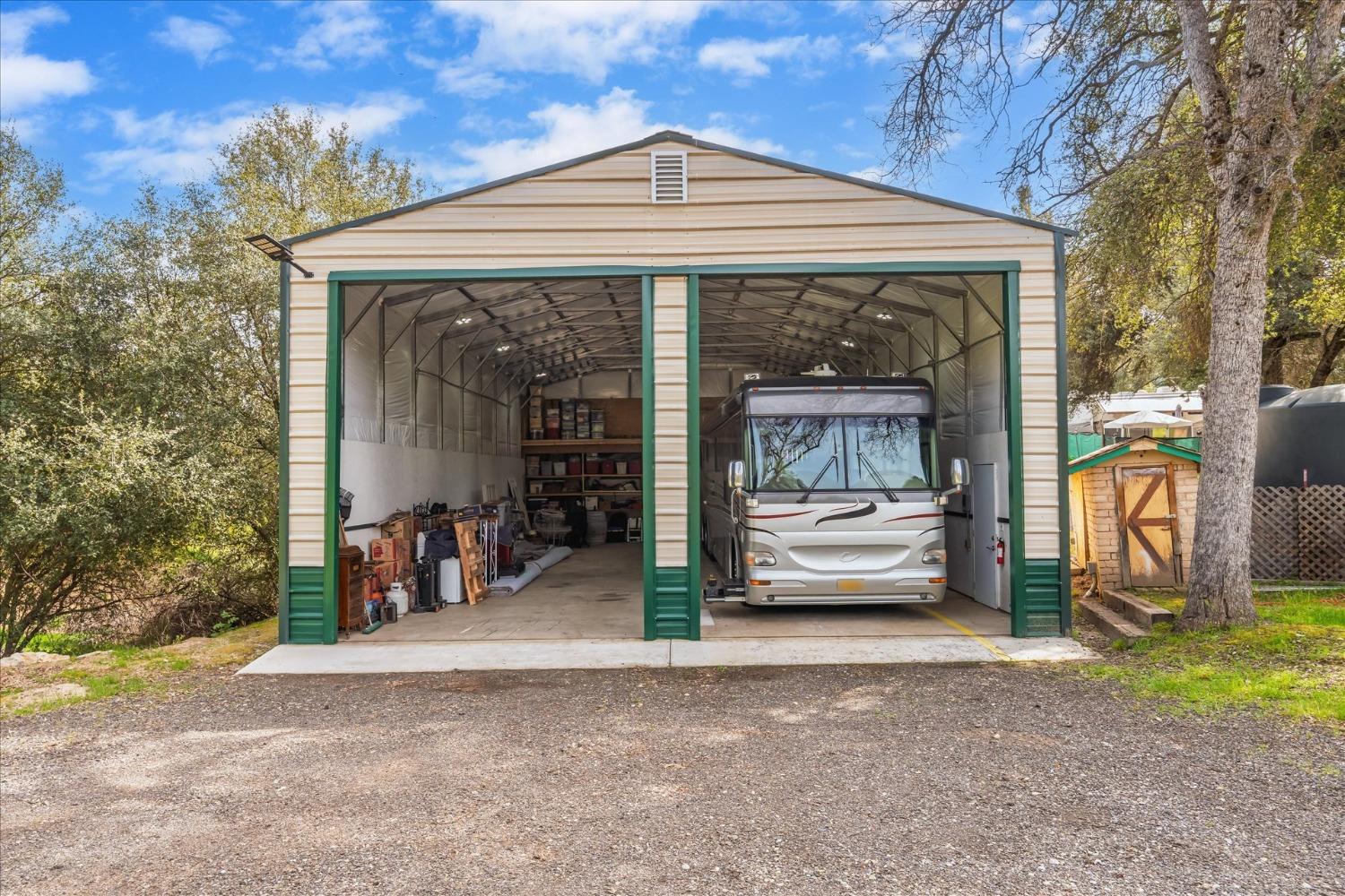 48994 Manzanita Road Oakhurst, CA 93644 - Photo 39 of 43 a view of a car park in front of house