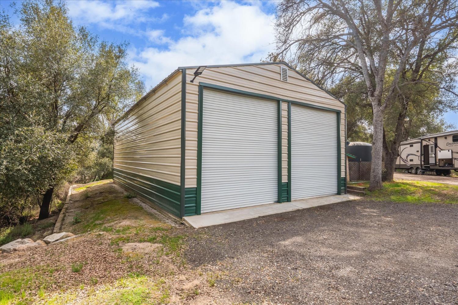 48994 Manzanita Road Oakhurst, CA 93644 - Photo 41 of 43 a view of a house with a yard