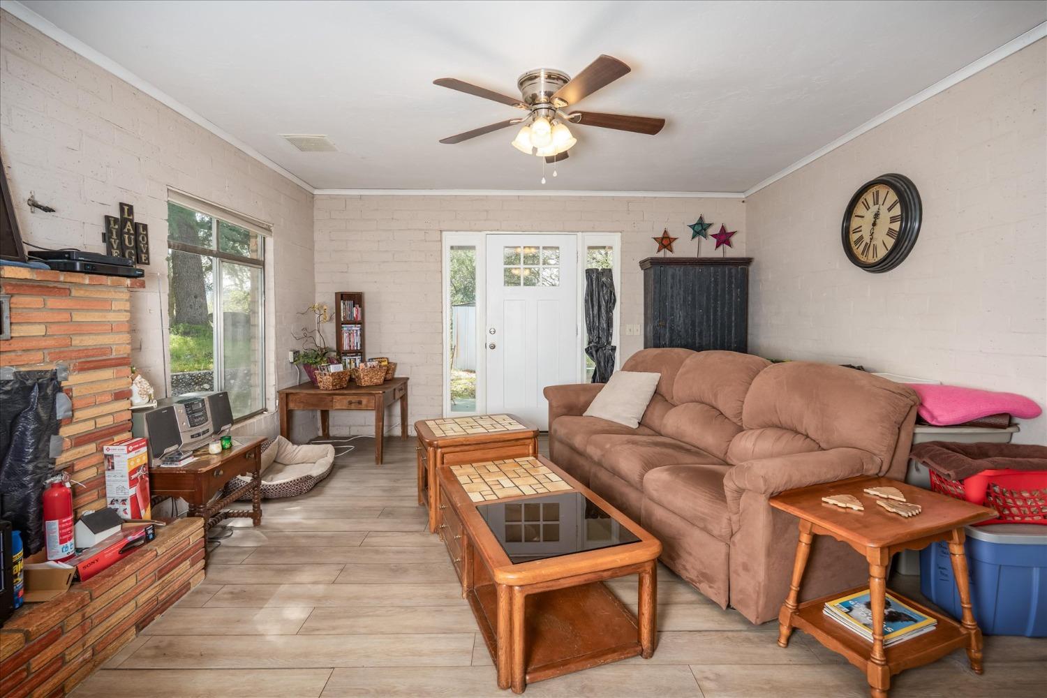 48994 Manzanita Road Oakhurst, CA 93644 - Photo 6 of 43 a living room with furniture and a flat screen tv