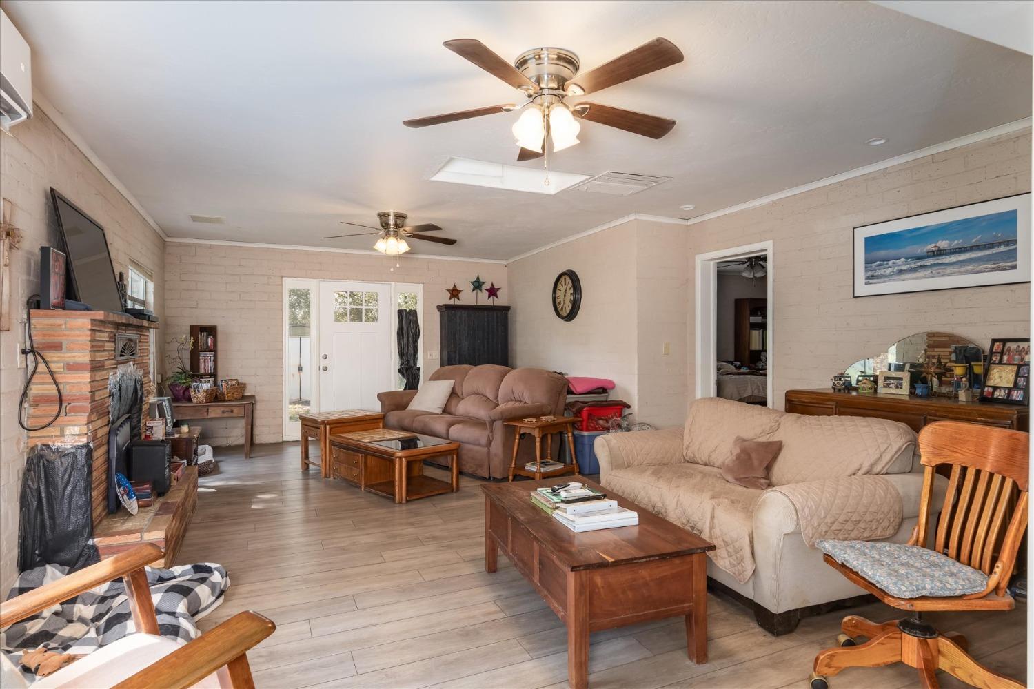 48994 Manzanita Road Oakhurst, CA 93644 - Photo 8 of 43 a living room with furniture and a flat screen tv