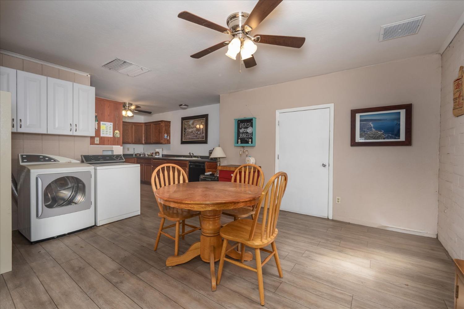 48994 Manzanita Road Oakhurst, CA 93644 - Photo 9 of 43 a dining room with furniture and a fireplace