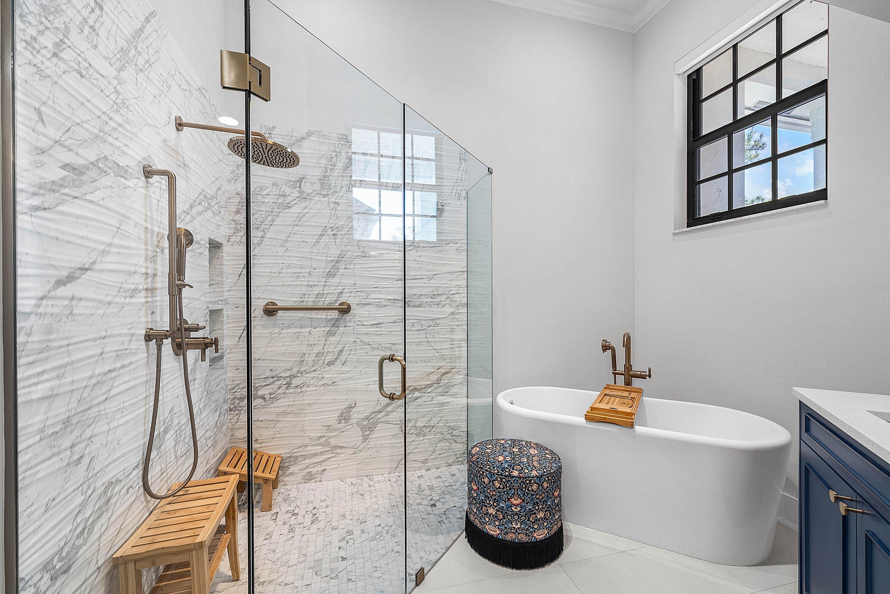 2413 Northwest 64th Street Boca Raton, FL 33496 - Photo 13 of 45 a bathroom with a sink a bathtub and shower