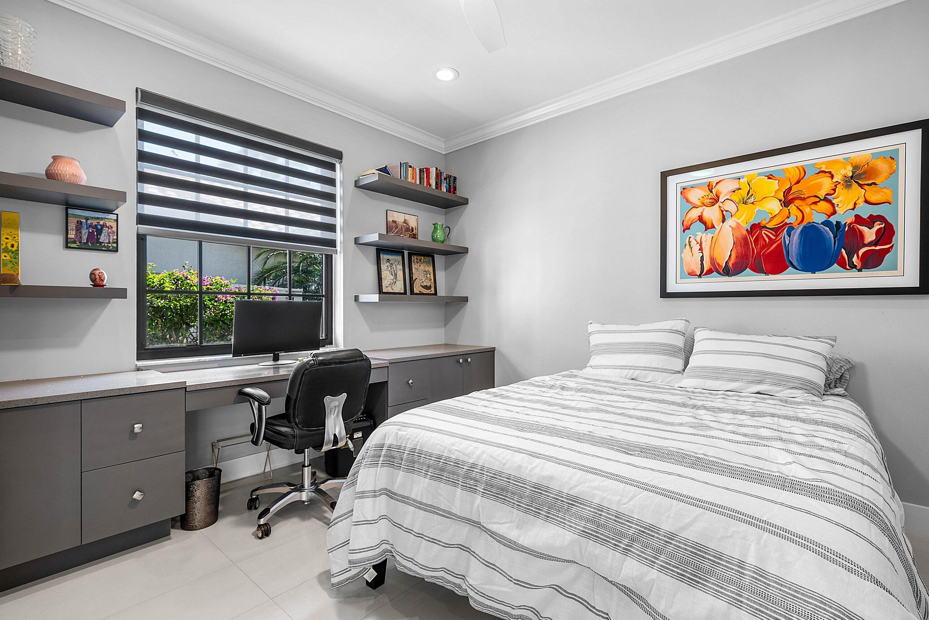 2413 Northwest 64th Street Boca Raton, FL 33496 - Photo 16 of 45 a bedroom with a bed and a window