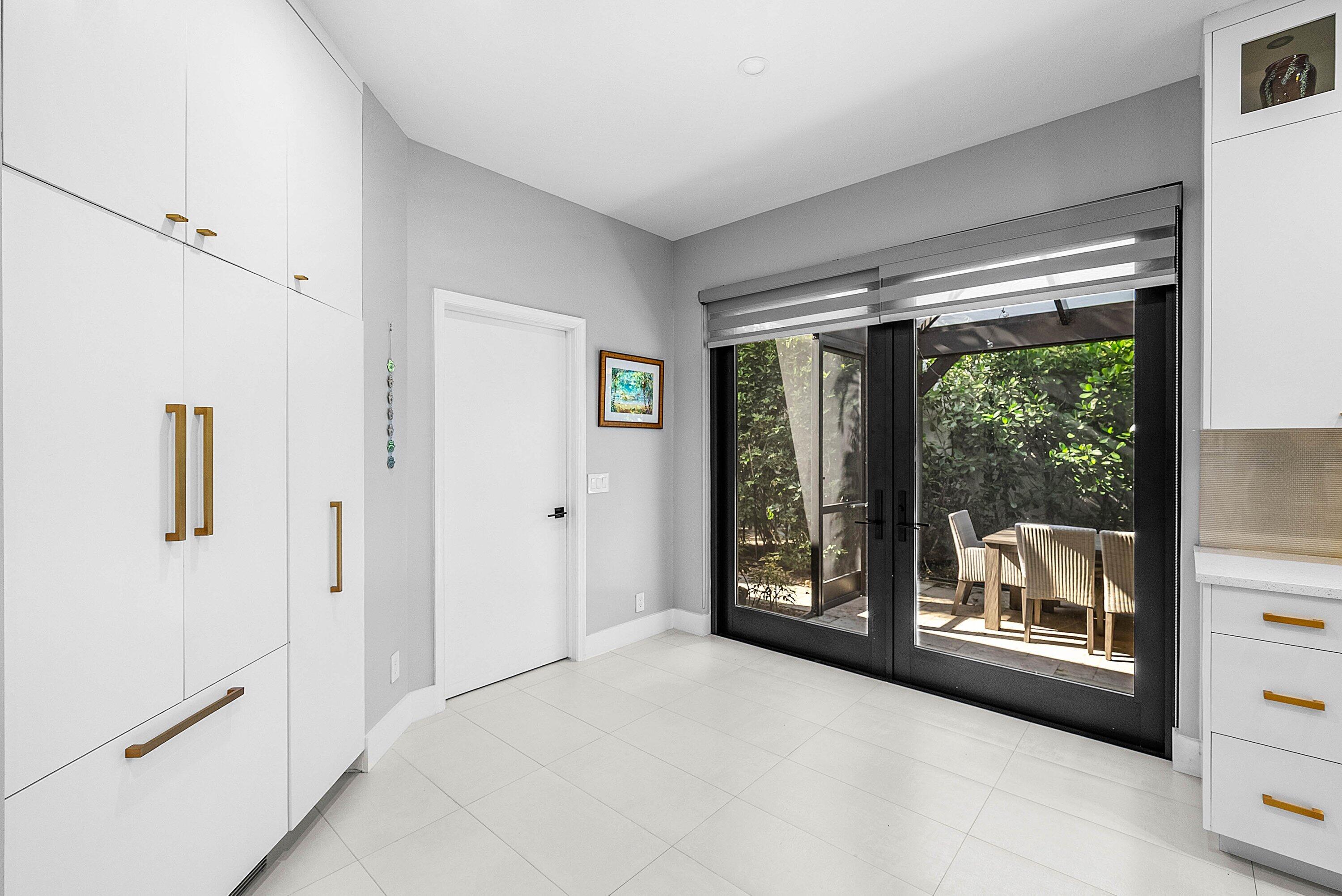 2413 Northwest 64th Street Boca Raton, FL 33496 - Photo 18 of 45 a view of hallway with a large window and pool table