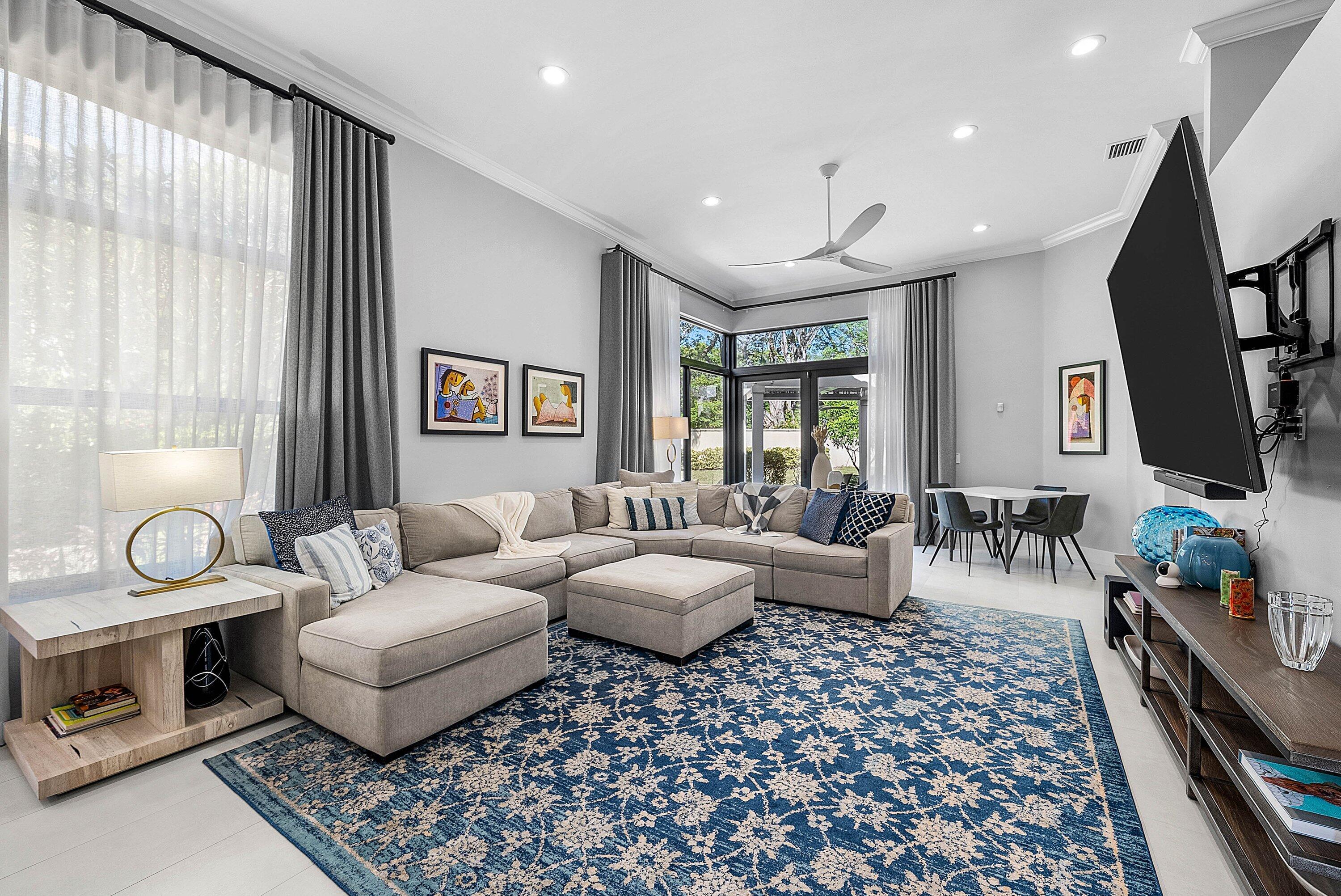2413 Northwest 64th Street Boca Raton, FL 33496 - Photo 3 of 45 a living room with furniture and a window