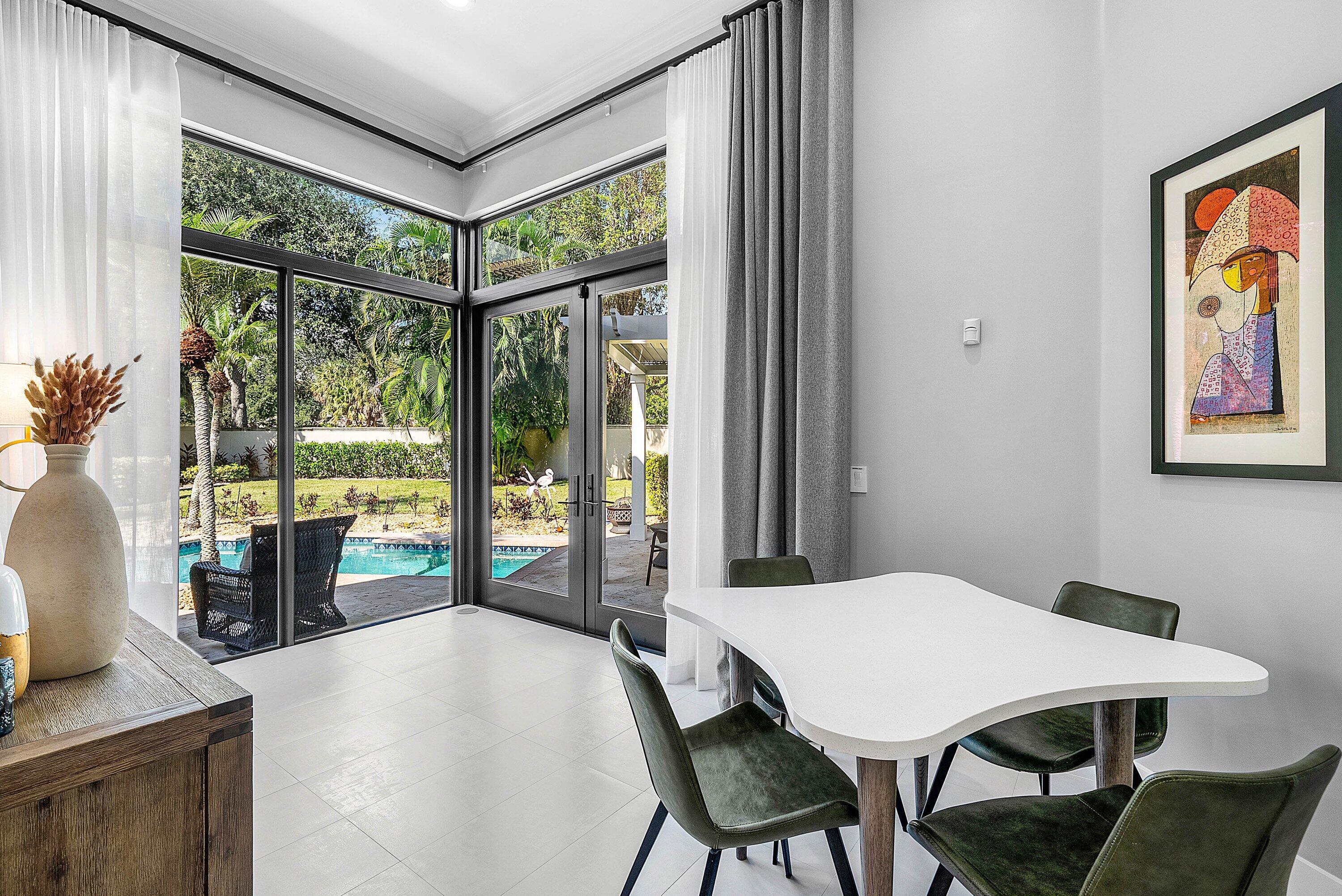 2413 Northwest 64th Street Boca Raton, FL 33496 - Photo 4 of 45 a view of a dining room with furniture window and outside view