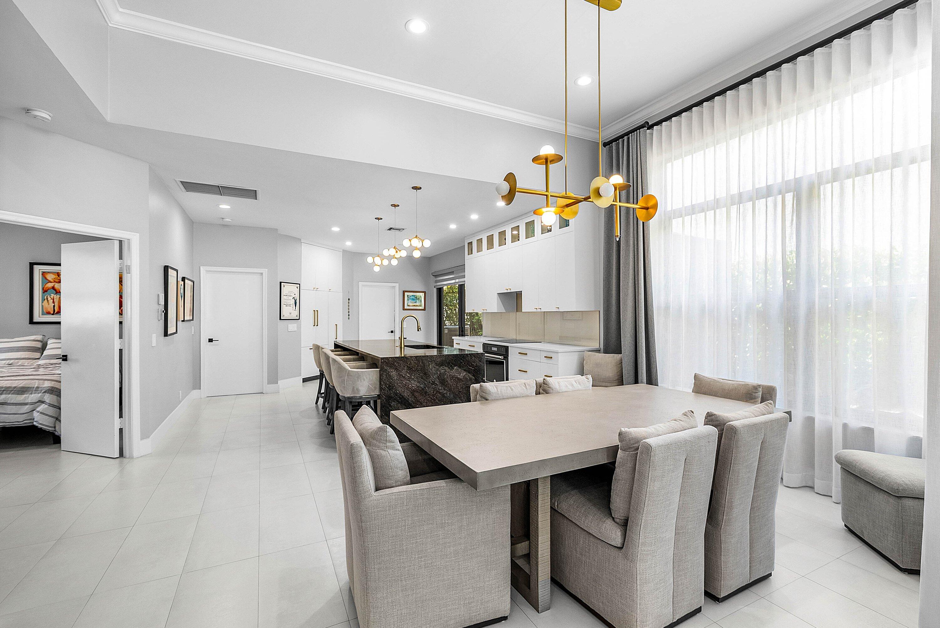 2413 Northwest 64th Street Boca Raton, FL 33496 - Photo 7 of 45 a view of a dining room with furniture window and wooden floor