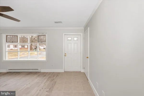 a view of an empty room with a window