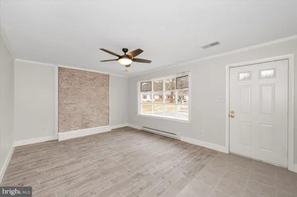 a view of an empty room with a window