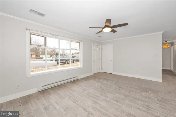 a view of an empty room with a window