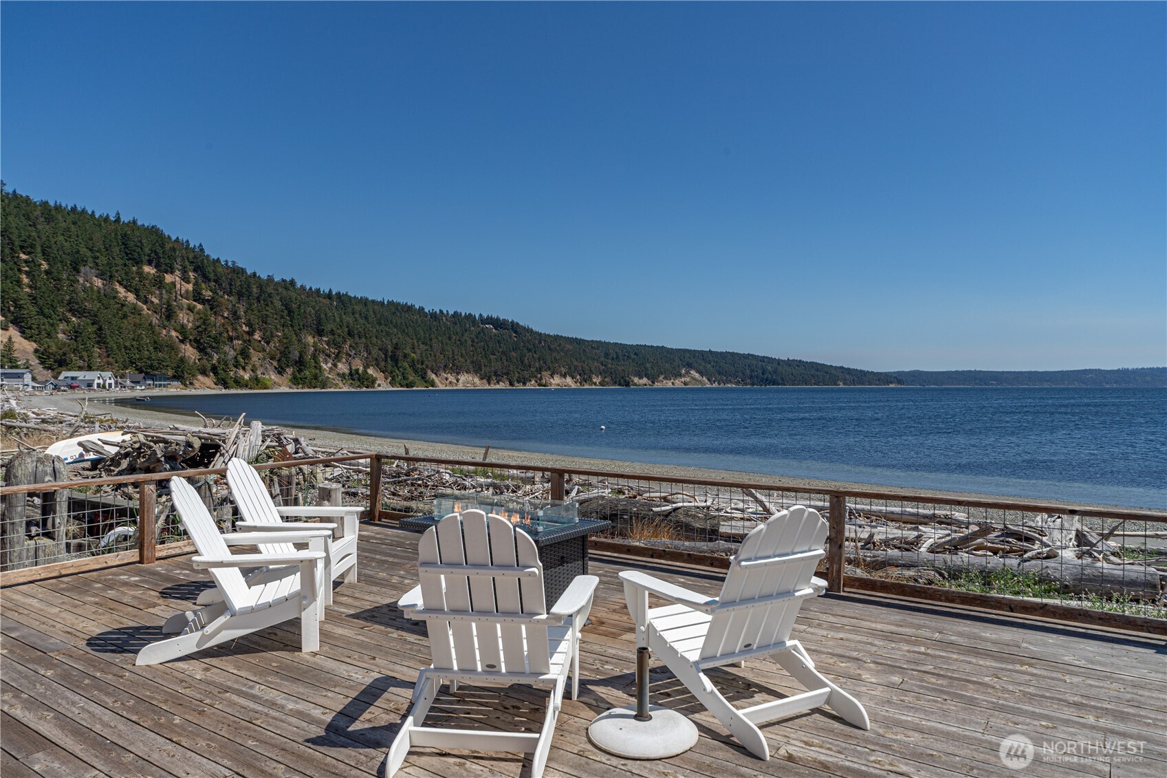 950 Beckett Point Road Port Townsend, WA 98368 - Photo 1 of 37 a view of chairs and table on wooden floor
