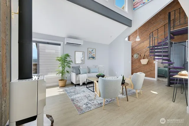 a living room with furniture a rug and a window