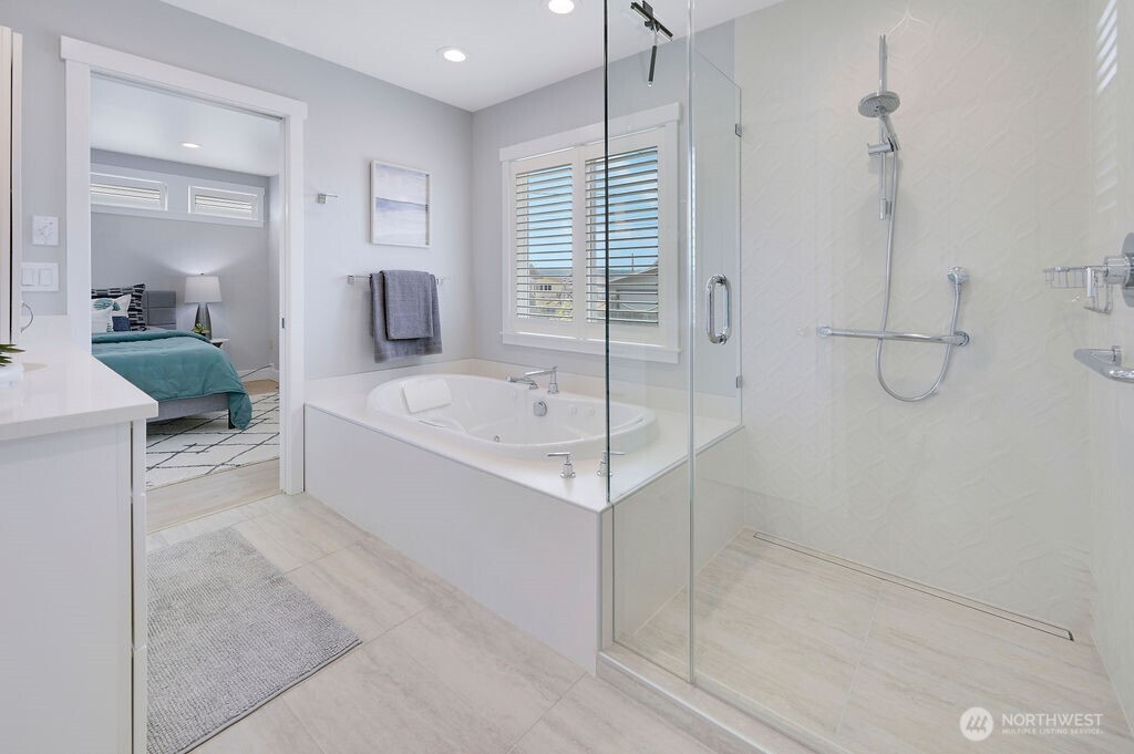 950 Beckett Point Road Port Townsend, WA 98368 - Photo 14 of 37 a bathroom with a bathtub and a shower
