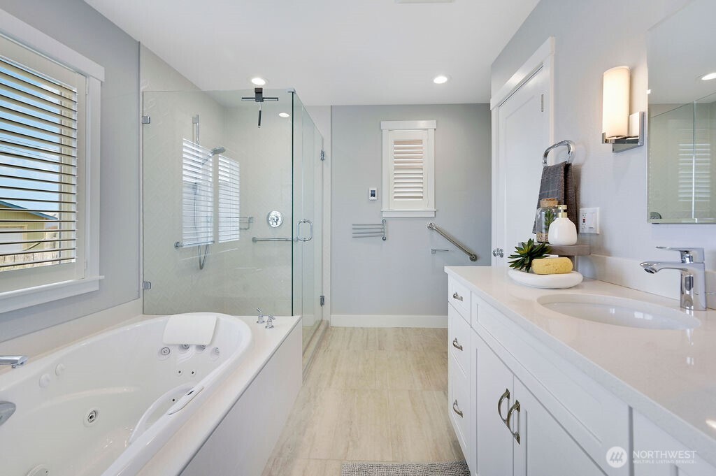 950 Beckett Point Road Port Townsend, WA 98368 - Photo 15 of 37 a bathroom with a tub sink and mirror
