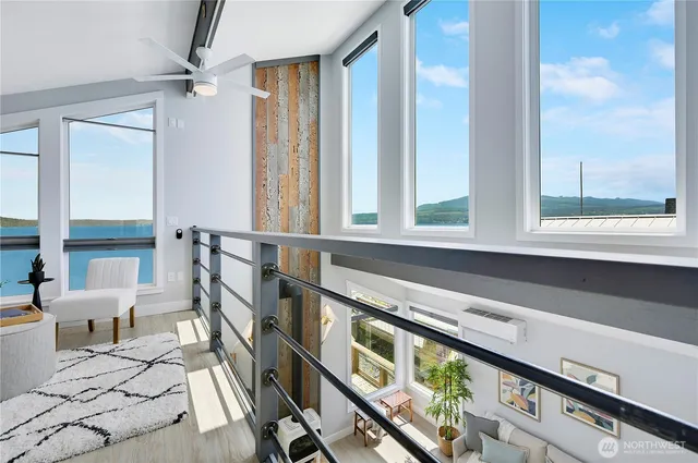 a view of an entryway with wooden floor and windows