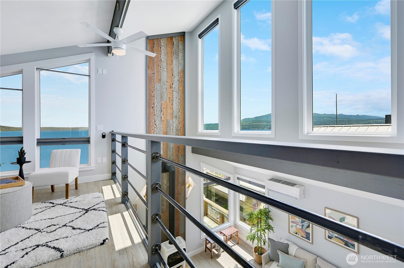 950 Beckett Point Road Port Townsend, WA 98368 - Photo 16 of 37 a view of an entryway with wooden floor and windows