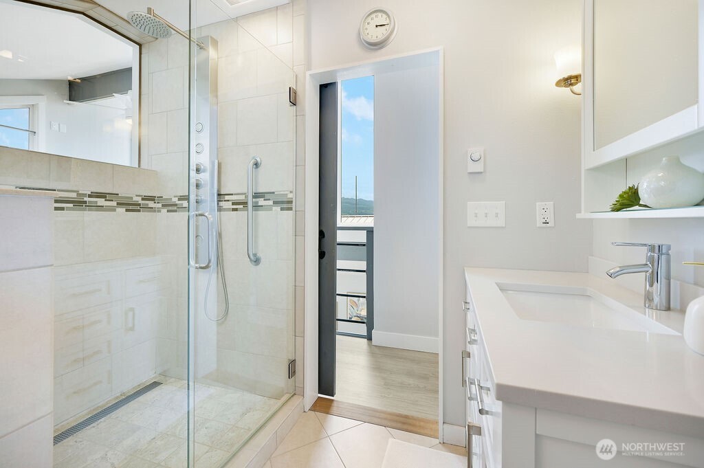 950 Beckett Point Road Port Townsend, WA 98368 - Photo 25 of 37 a bathroom with a sink and a shower