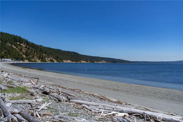 a front view of house with yard and car parked