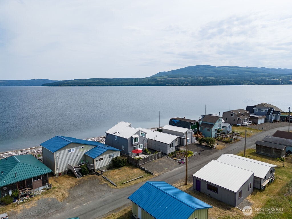 950 Beckett Point Road Port Townsend, WA 98368 - Photo 36 of 37 a terrace with outdoor seating and city view